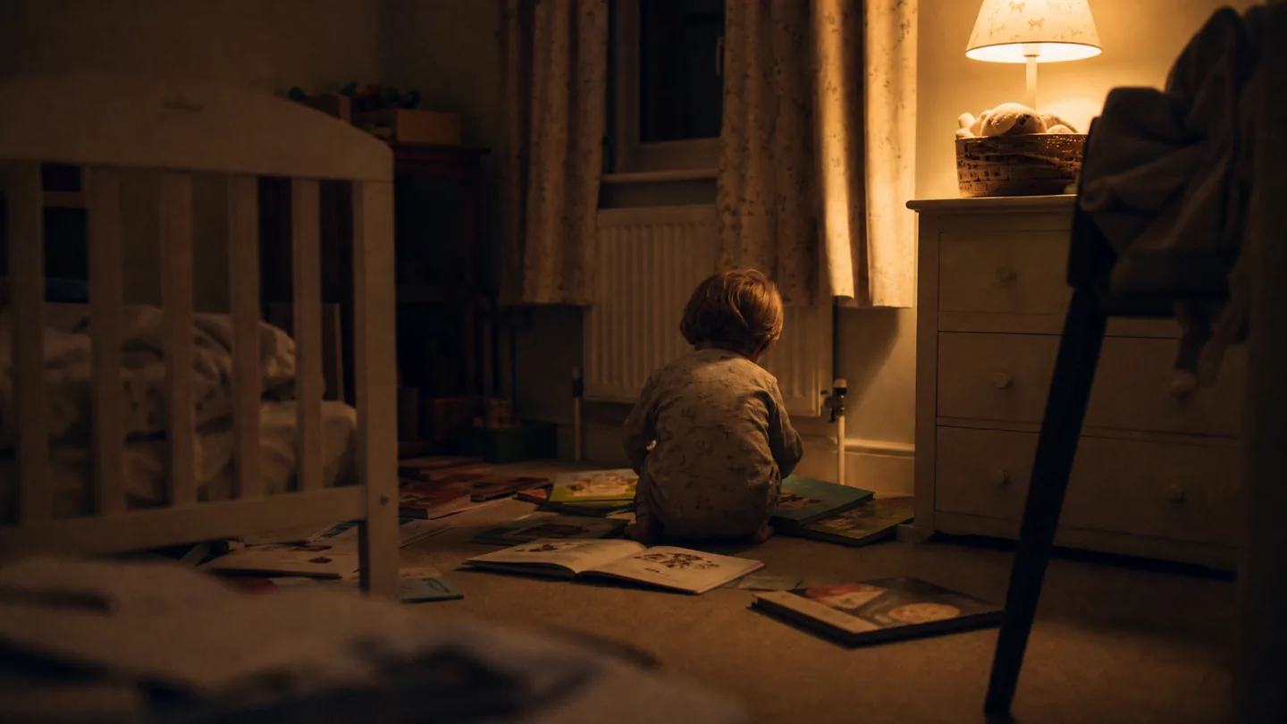 toddler bedroom, books on the floor, evening
