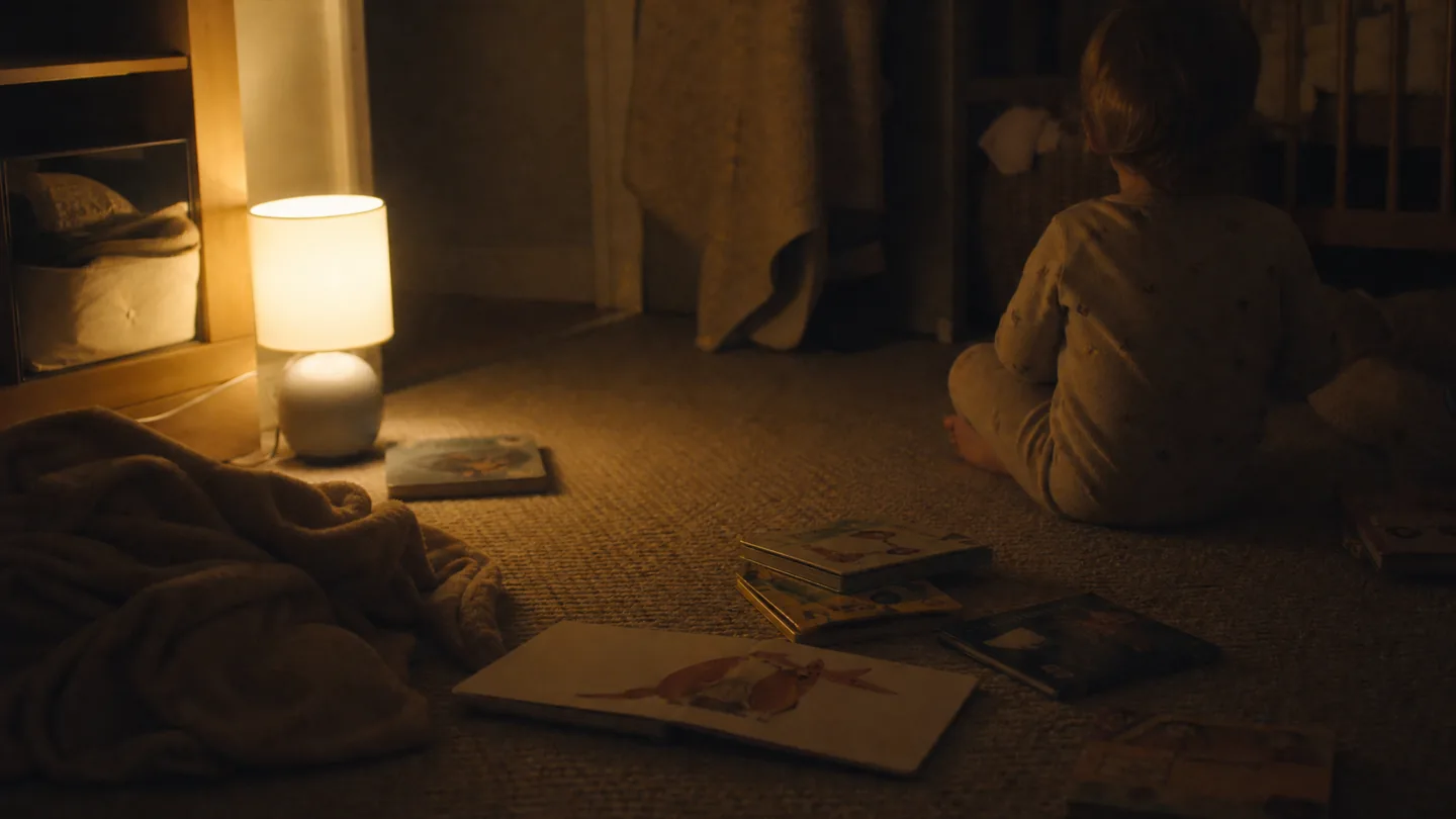 nursery floor, low lamp, bedtime books