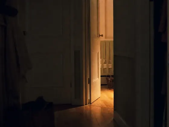 hallway, nursery door ajar, evening