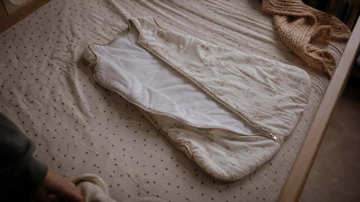 sleeping bag laid out on a cot mattress
