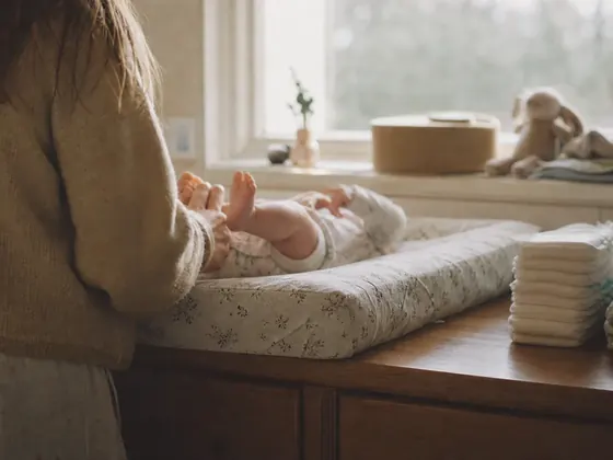 changing mat, folded nappies, morning light