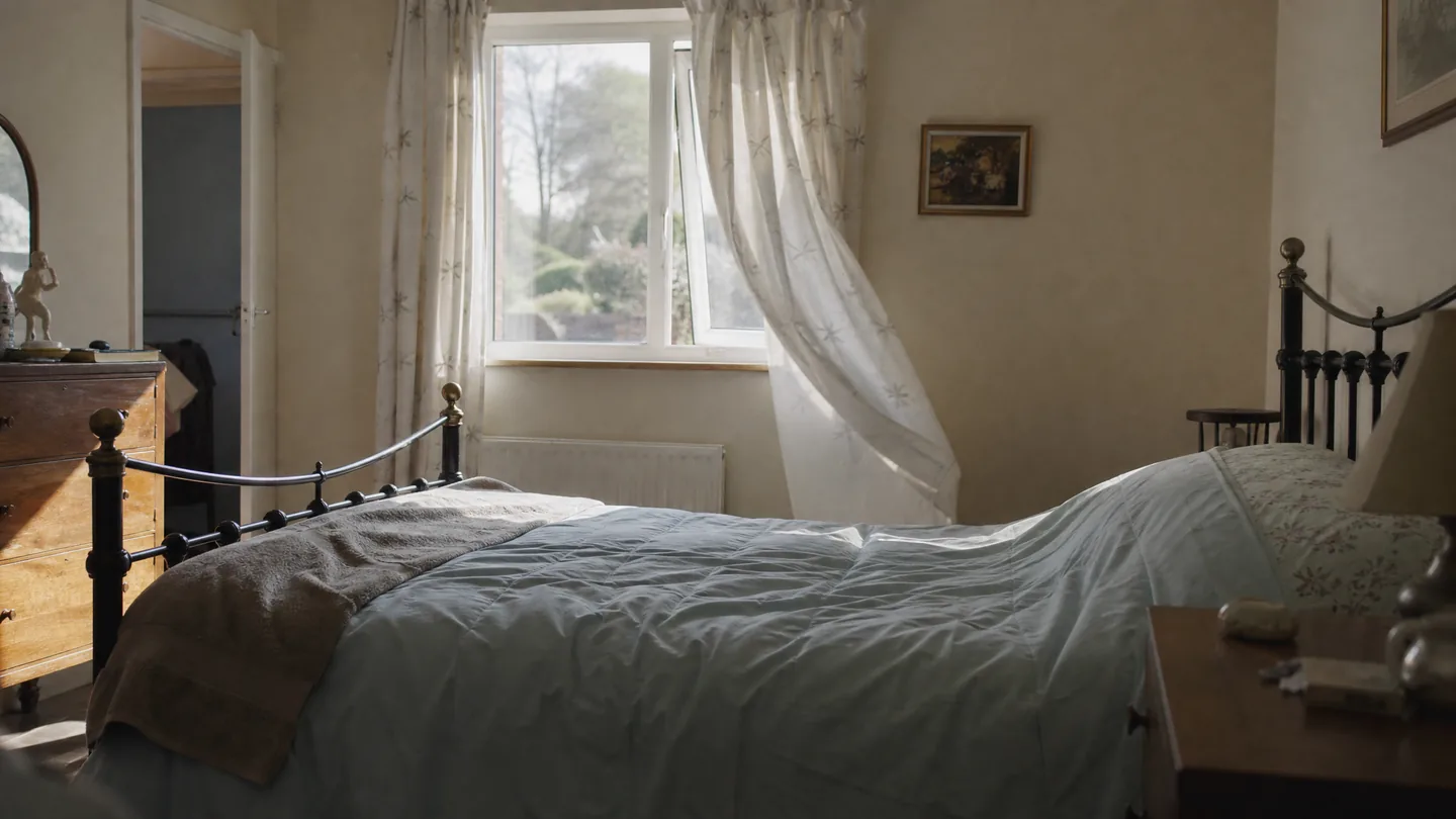 open window, morning light on a bed
